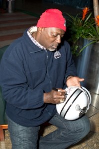 2012 Celebrity Guest Ottis Anderson Autographing a Super Bowl XLVI Helmet 